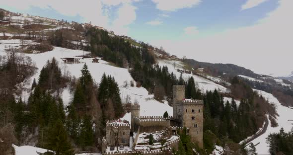 Beautiful reveal of Gernstein Castle located in the Dolomites, during winter time.