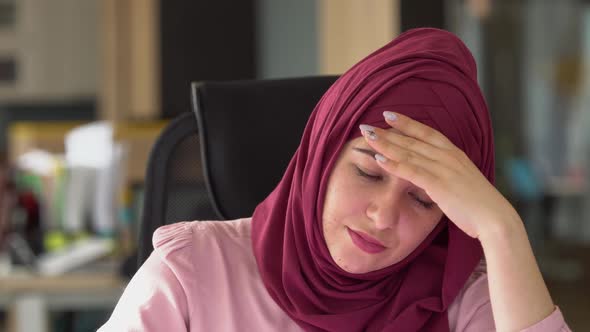 Sad Modern Muslim Business Woman in Hijab in Office