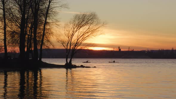 Bunch of People Kayaking on a City River