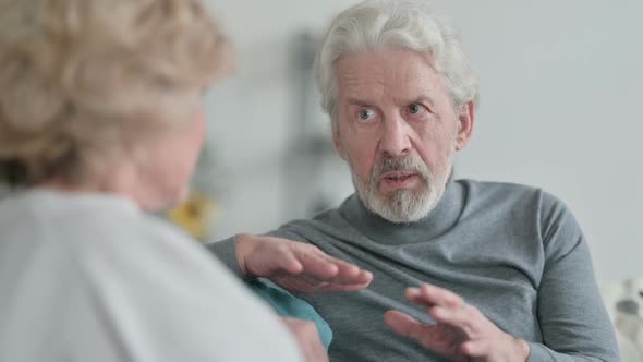 Old Man Talking to Happy Old Woman