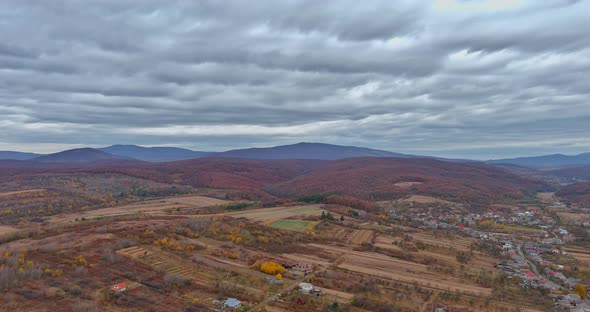 Agricultural Land From a Height in the Valley Near the Mountains on a Overcast Autumn Morning