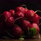 Delicious fresh farmer radish bunch rotates against black background - VideoHive Item for Sale