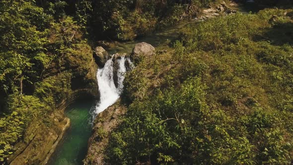 Waterfall in the Mountains. alt