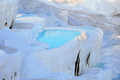 Travertine terraces with clear blue water in Pamukkale - PhotoDune Item for Sale