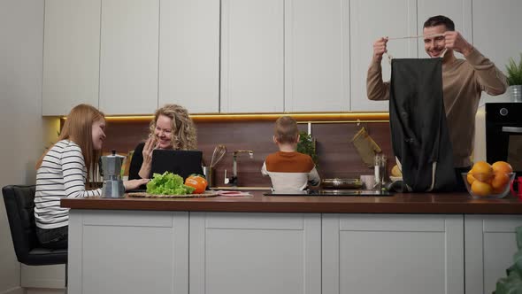 United Mute Family Spending Leisure in Kitchen