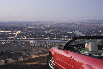 car watching the sunset over the Clearwater River and the city of Lewiston, Idaho, USA.