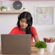 Portrait of Asian schoolgirl studying online via laptop - VideoHive Item for Sale