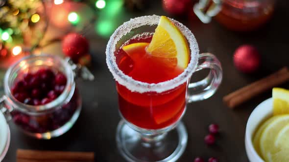 Adding slices of orange into mulled wine