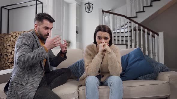Woman  with Her Husband on the Couch and Listening How He Complaining on His Life with Her