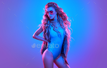 n disco bodysuit, makeup. Party disco neon nightclub vibes. Fashionable model portrait, creative art neon pink blue light