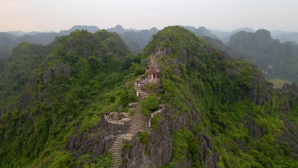 Aerial Shot of the Small Temple and a Dragon on the Top of Marble Mountain Mua Cave Mountain in Ninh