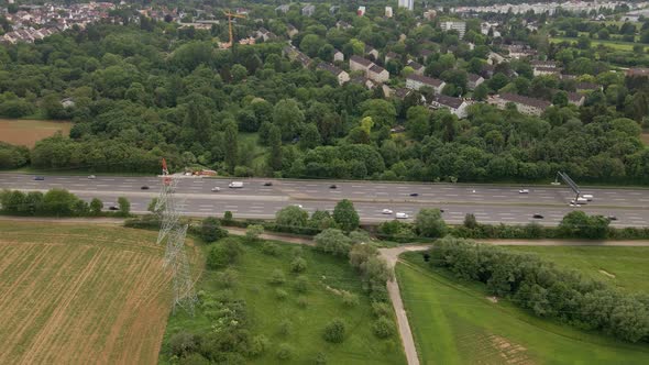 Moderate afternoon traffic on the Autobahn A66 near Frankfurt, Germany. Static aerial perspective