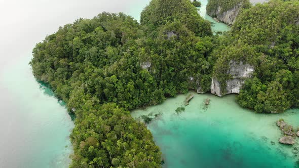 Aerial View Of Triton Bay With Turquoise Sea And Green Tropical Trees In Kaimana Islands.