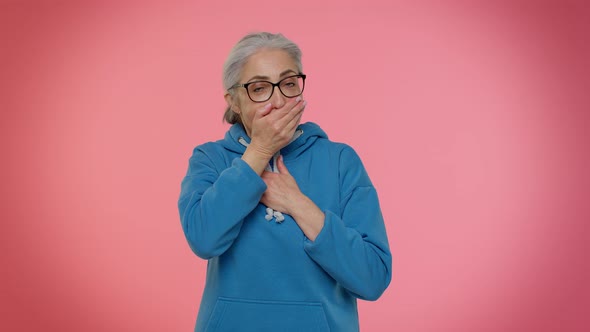 Frightened Elderly Woman Closing Her Mouth with Hand Gestures No Refusing to Tell Terrible Secret