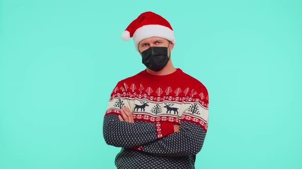 Man in Christmas Red Sweater Wearing Face Mask Ppe to Safe From Coronavirus on Lockdown Quarantine