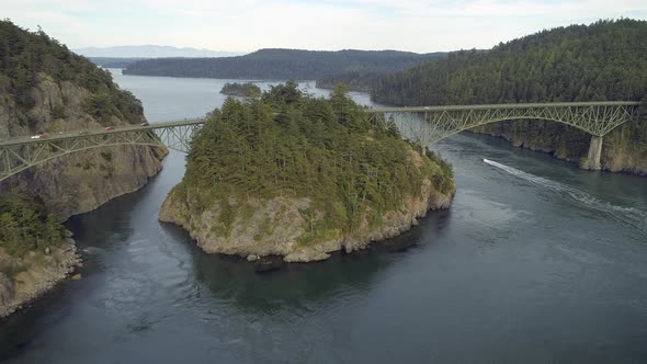 Aerial Film Of Boat Traveling Under Deception Pass Bridge