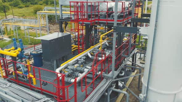 Aerial View Gas Production Station. Metal Construction with Valves on the Pipes. Distribution and