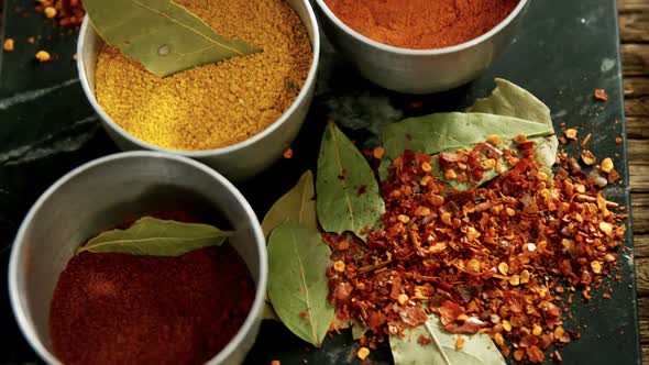 Various spices on concrete tray 4k