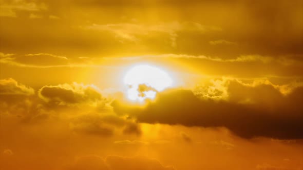 Sunset in the Sky Through Yellow Layered Clouds Timelapse