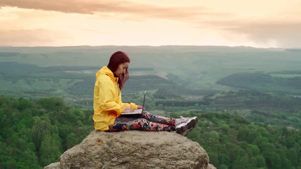 Woman Freelancer Works at Laptop on Top Mountain Backdrop Stunning Mountain