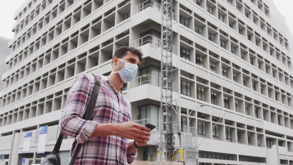 Side view of Caucasian man on the go wearing a corovirus covid19 mask