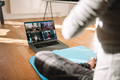 Woman conducting virtual fitness classes over video conference - PhotoDune Item for Sale