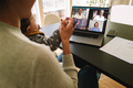 Woman at home video conferencing with colleagues - PhotoDune Item for Sale
