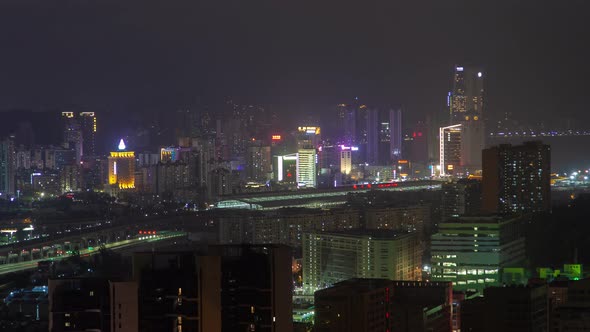 Macau – Zhuhai Border Earial Cityscape Night Timelapse Pan Up