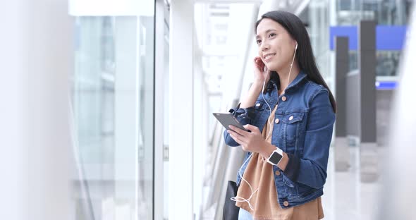 Woman use of mobile phone in Hong Kong airport 