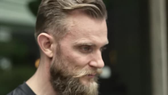 Portrait Shot of a Bearded Man on Focus While Wearing Polar Lens Sunglasses