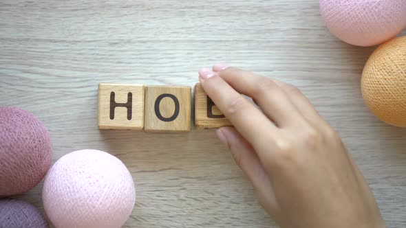 Hobby, Woman Making Word of Wooden Cubes, Colorful Thread Balls Lying on Table