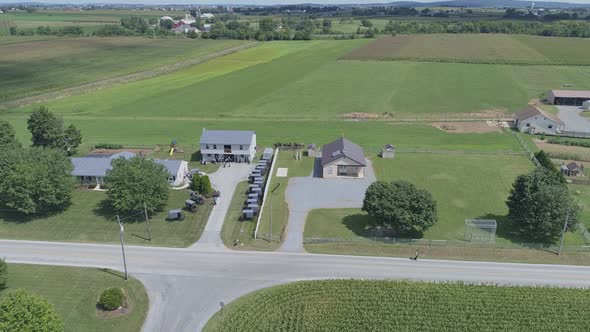 Aerial View of Amish Church Meeting with Horse and Buggies