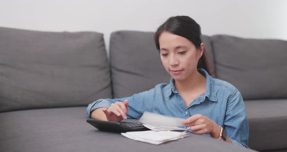 Woman calculate the use of daily life at home