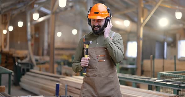 Carpentry Worker Having Fun at the Factory