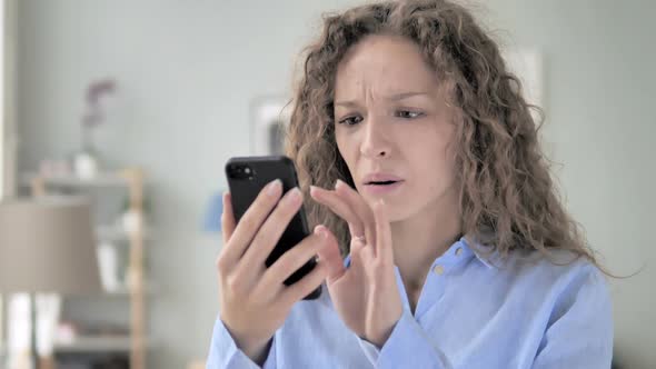 Curly Hair Woman Shocked By Results on Phone