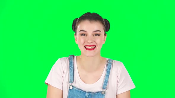 Girl Cute Laughing Against Green Screen at Studio. Slow Motion