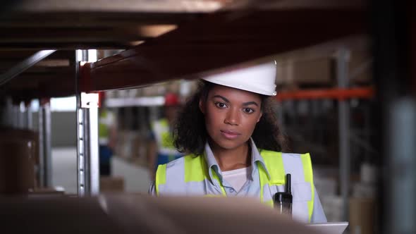 Warehouse Worker Using Tablet for Stock Inventory