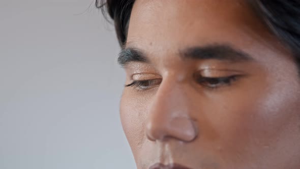 Make Up Artist Doing Soft Nude Look on Her Male Model - Applying Mascara on His Eyelashes