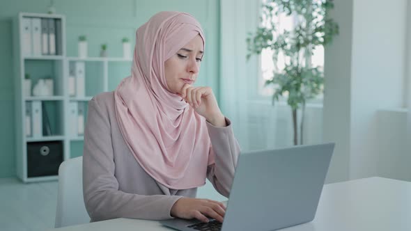 Arabian Worker User Islamic Businesswoman Muslim in Hijab in Office Sitting Table Looking Laptop