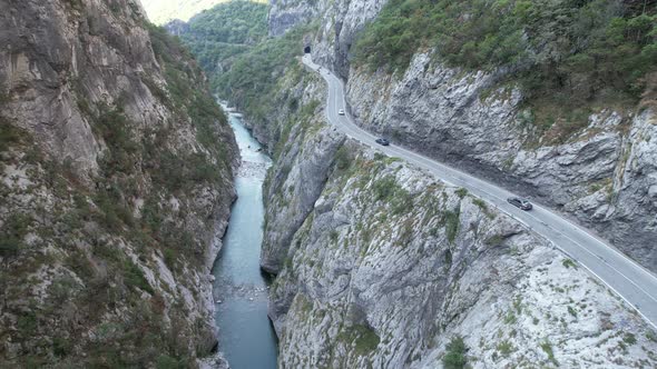 Aerial view of Tara river canyon, big mountains and road Montenegro, Europe