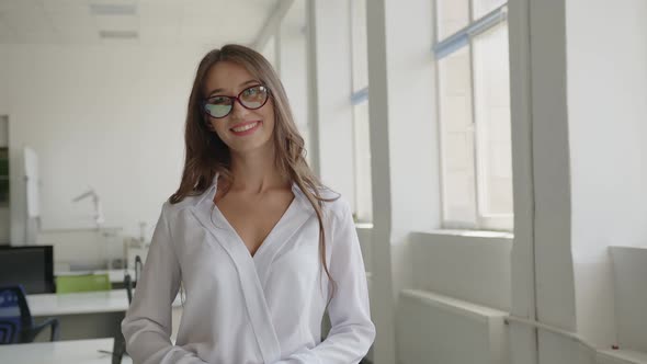 Close Up View of Standing Woman in Glasses