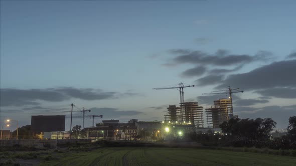 Timelpase of sun rising from behind Mriehel Quads highrise in Malta