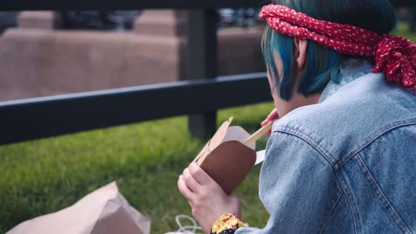 Kind of From the Back Hippie Hipster Woman Eat a Wok