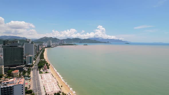 high altitude view of the coastal road along the white sand beach of Nha Trang Vietnam overlooking t