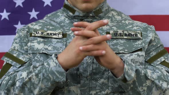 Military Man Praying US Flag Background, Moment of Silence, Respect for Heroes