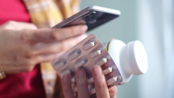 Unrecognizable Woman Reading Online Medication Instructions