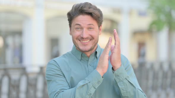 Portrait Shot of Happy Middle Aged Man Clapping, Applauding