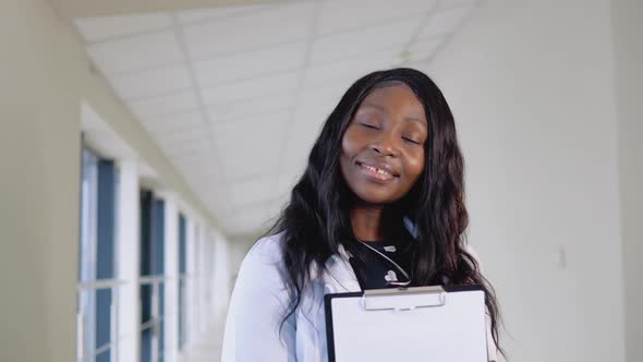 Smiling Young African Female Doctor Close Up Portrait