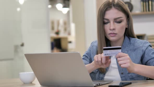 Online Shopping with Credit Card on Laptop By Young Girl