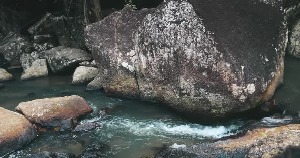 Closeup Thailand's Waterfall River Rocky Shore with Rapids Stones at Than Sadet National Park